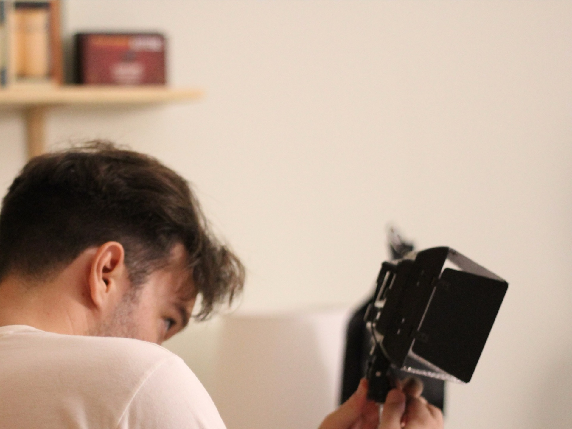 Behind the scenes — photographer reviewing a frame through the medium-format camera back