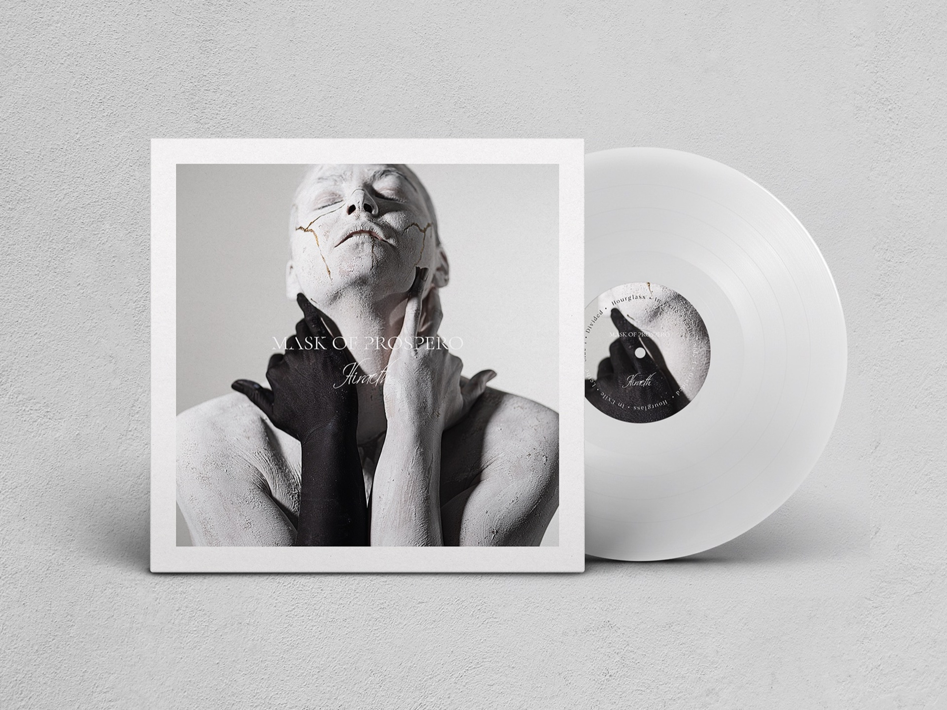 Hiraeth — Mask of Prospero album cover and clear vinyl displayed together on a soft grey surface