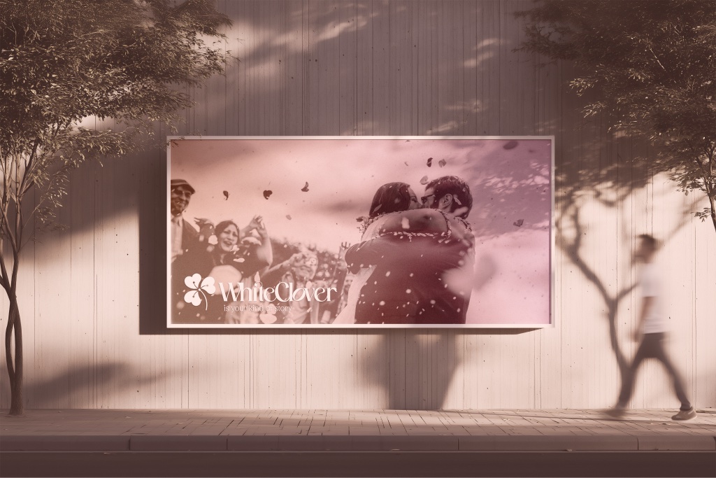 WhiteClover billboard in an urban setting — 'your kind of story' headline beside the clover mark